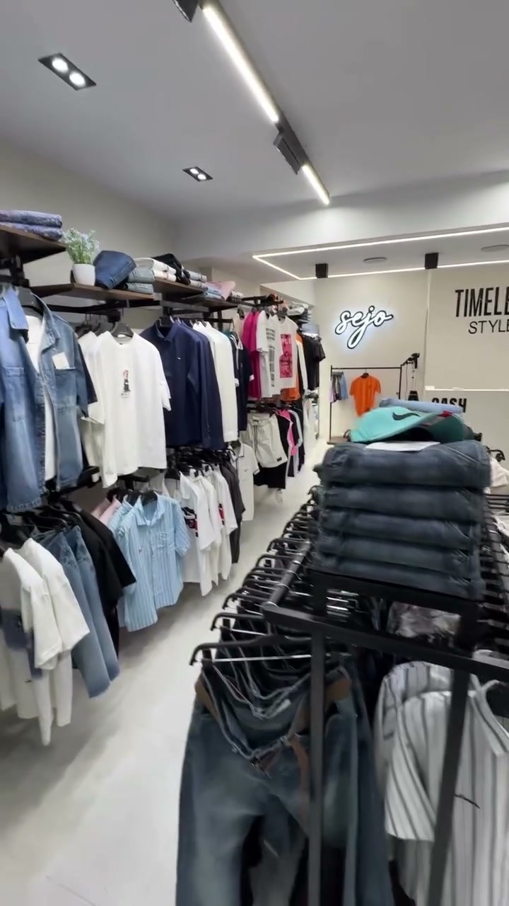 Inside the Sejo store, racks of shirts, jeans and tees